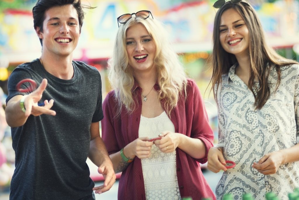 friends enjoying games at carnival